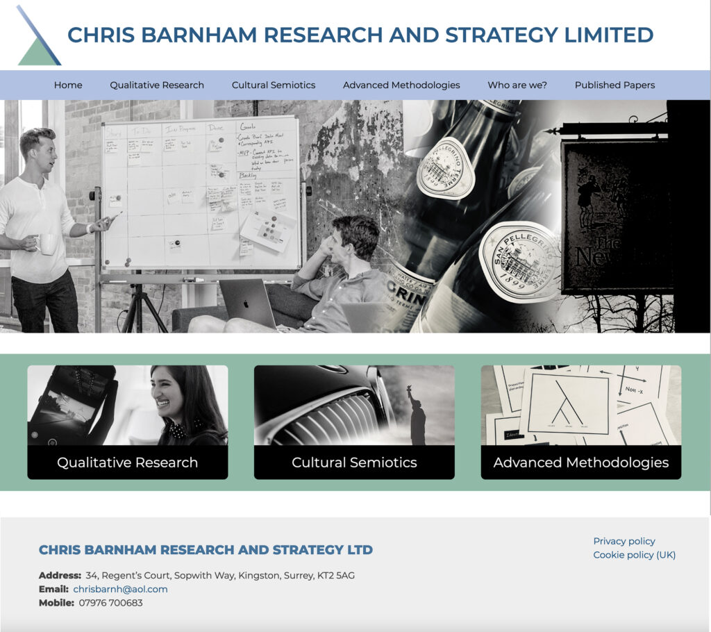 Screenshot of homepage of Chris Barnham website featuring blended black and white photos and contact information.